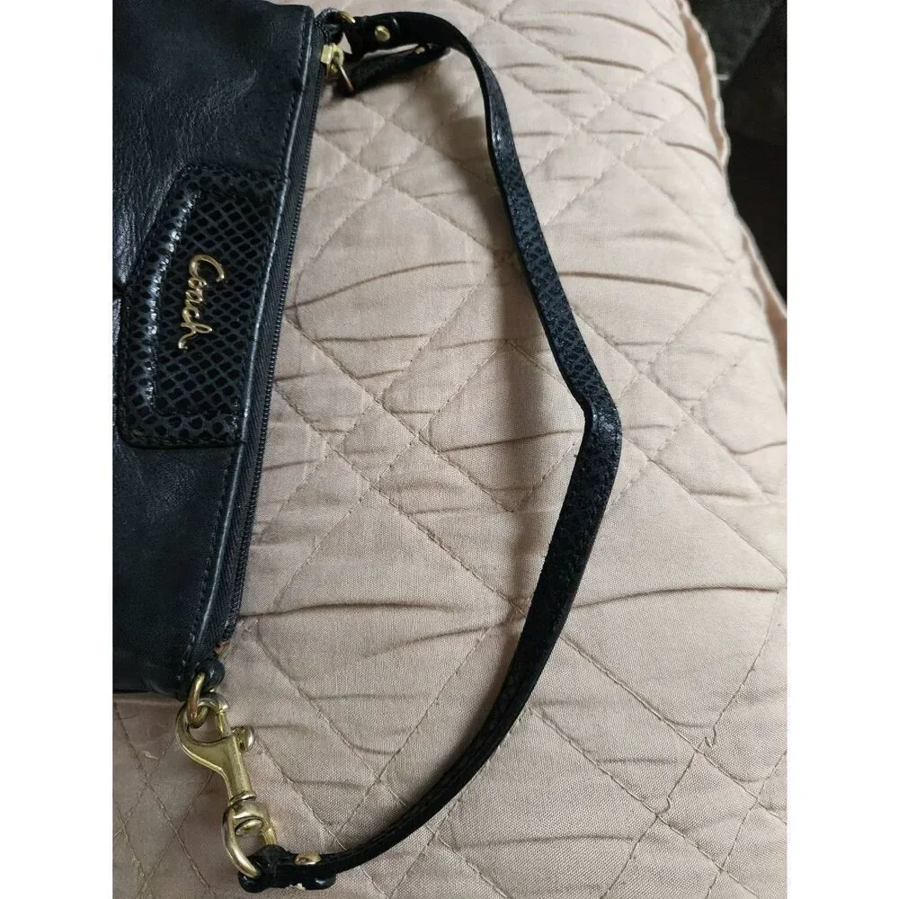Coach Ashley large black leather wristlet. Approx 9.5 wide, 5.5 high
